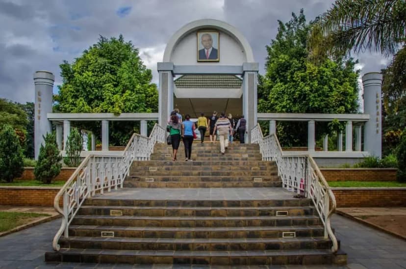 Banda Mausoleum in Malawi with visitors climbing the stairs to the historic landmark